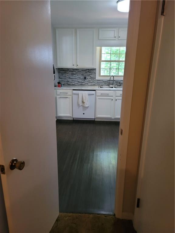 2212 Colonial Circle Gainesville, GA 30501 - Photo 17 of 57 a kitchen with a sink a window and cabinets