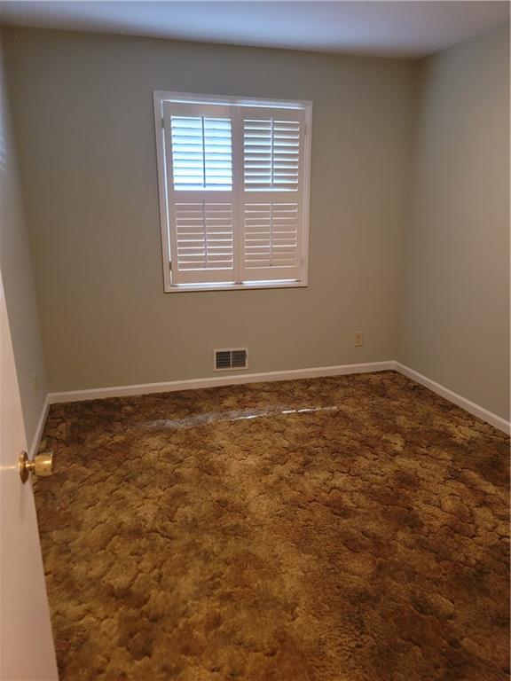 2212 Colonial Circle Gainesville, GA 30501 - Photo 18 of 57 an empty room with a window