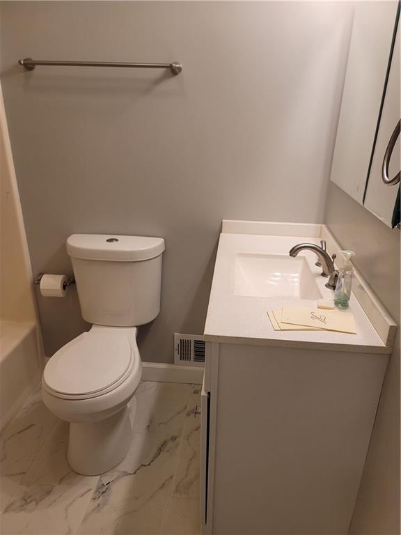 2212 Colonial Circle Gainesville, GA 30501 - Photo 24 of 57 a bathroom with a sink toilet and a mirror