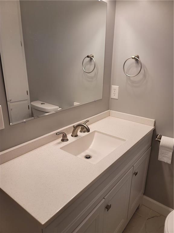 2212 Colonial Circle Gainesville, GA 30501 - Photo 28 of 57 a bathroom with a sink and a vanity