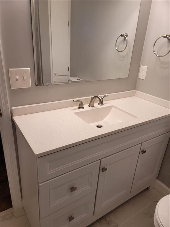 2212 Colonial Circle Gainesville, GA 30501 - Photo 32 of 57 a bathroom with a sink and a mirror