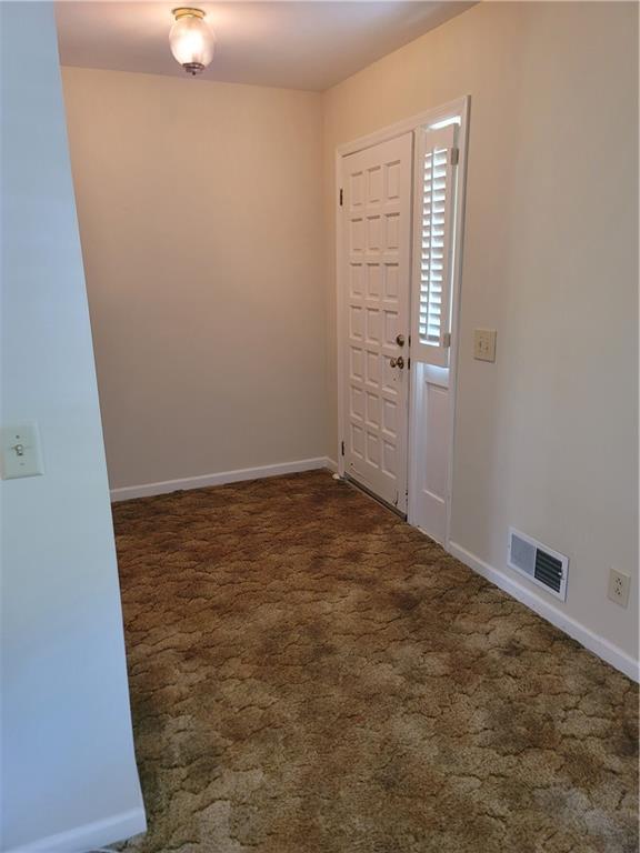 2212 Colonial Circle Gainesville, GA 30501 - Photo 5 of 57 an empty room with windows