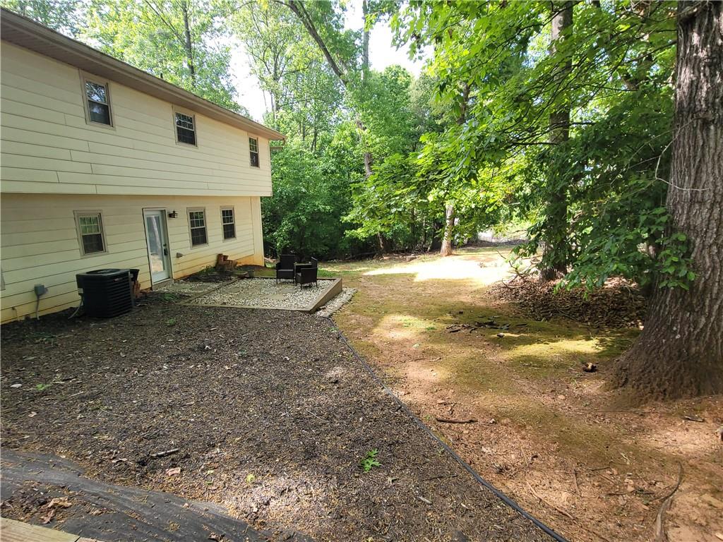 2212 Colonial Circle Gainesville, GA 30501 - Photo 52 of 57 a view of a backyard with large trees