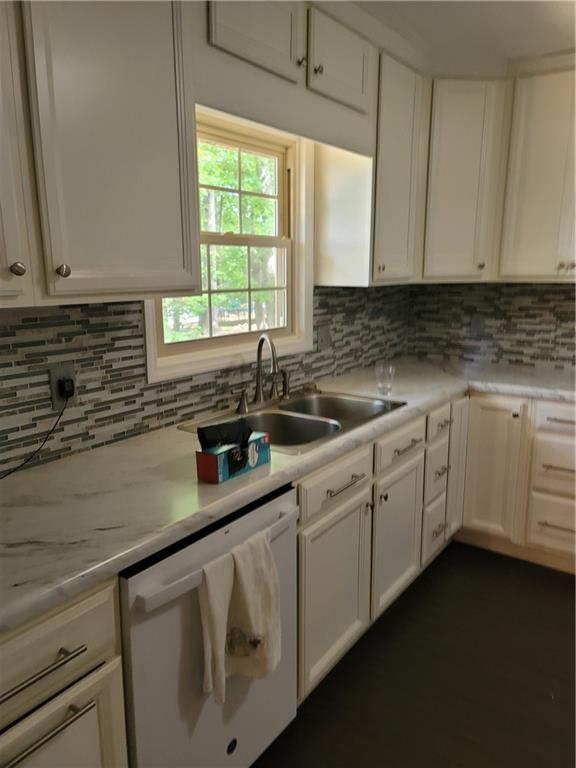 2212 Colonial Circle Gainesville, GA 30501 - Photo 7 of 57 a kitchen with sink cabinets and window