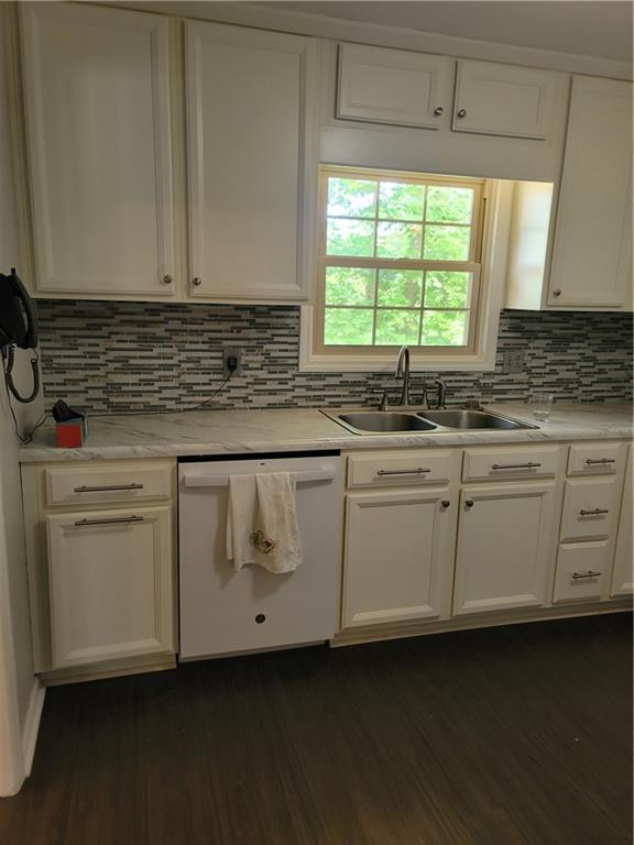 2212 Colonial Circle Gainesville, GA 30501 - Photo 9 of 57 a kitchen with granite countertop white cabinets and a sink