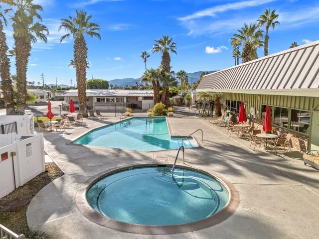 a view of a house with outdoor seating
