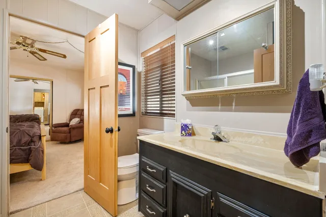 a en suite bathroom with a sink and a mirror
