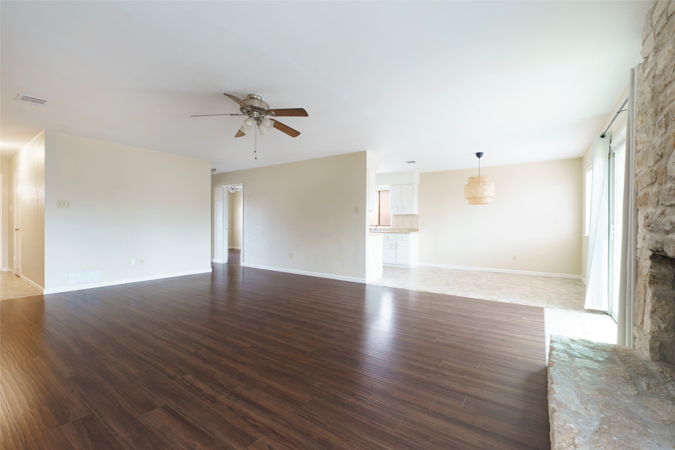 5603 Porsche Lane Austin, TX 78749 - Photo 12 of 25 an empty room with wooden floor and windows