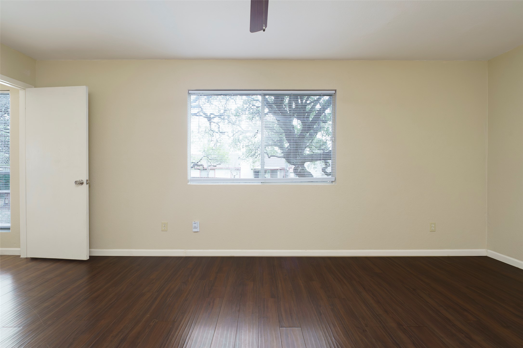 5603 Porsche Lane Austin, TX 78749 - Photo 14 of 25 an empty room with wooden floor and windows