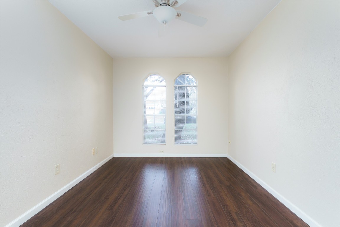 5603 Porsche Lane Austin, TX 78749 - Photo 15 of 25 an empty room with wooden floor and windows