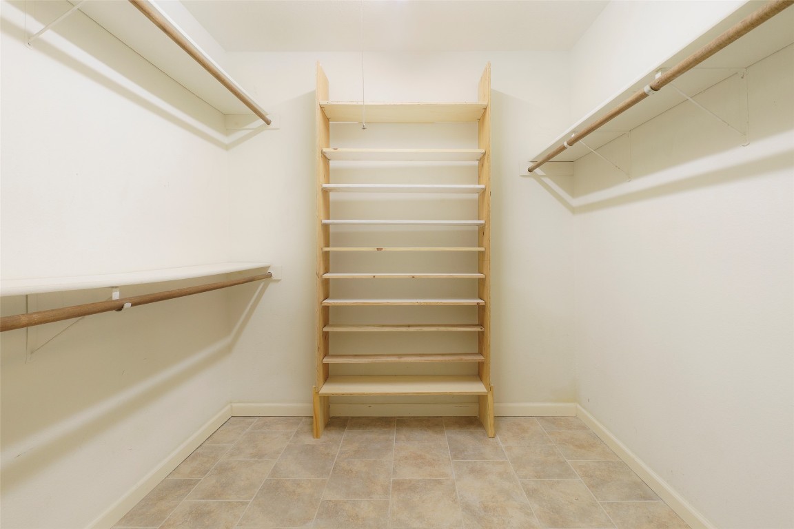 5603 Porsche Lane Austin, TX 78749 - Photo 19 of 25 a view of walk in closet with empty racks