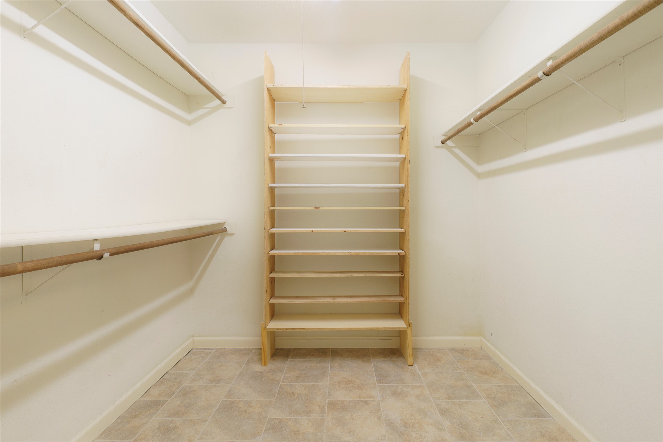 5603 Porsche Lane Austin, TX 78749 - Photo 19 of 25 a view of walk in closet with empty racks