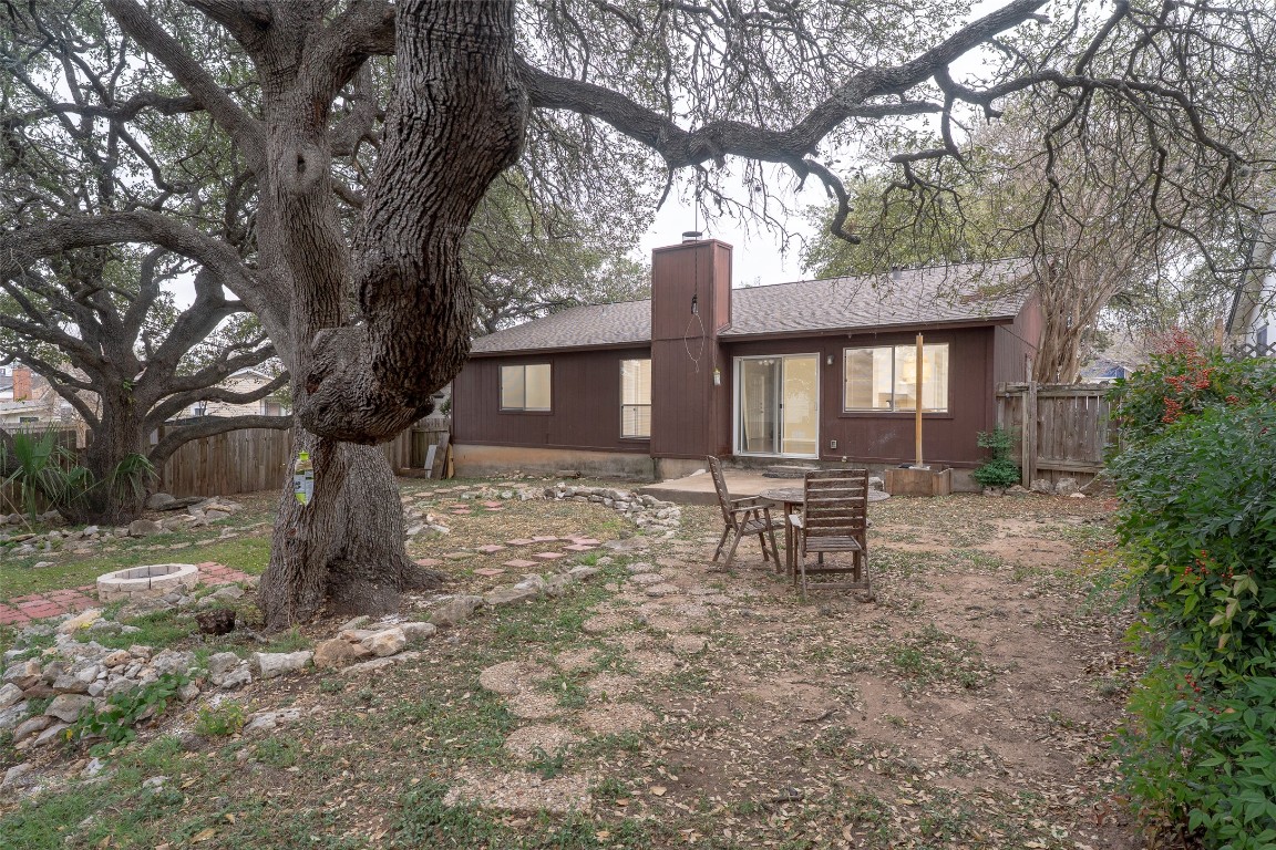 5603 Porsche Lane Austin, TX 78749 - Photo 22 of 25 a backyard of a house with table and chairs