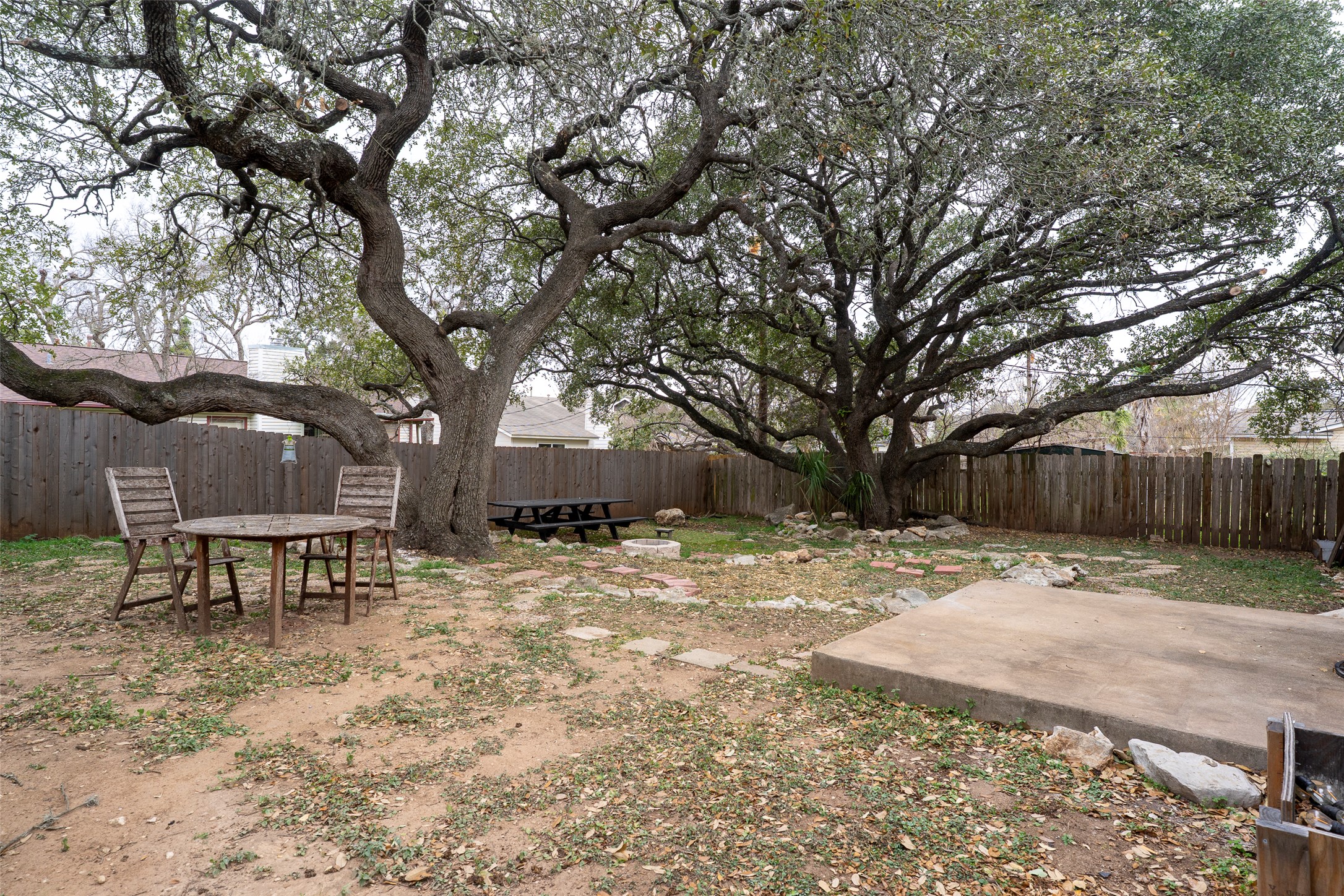 5603 Porsche Lane Austin, TX 78749 - Photo 24 of 25 a wooden bench sitting in middle of a yard