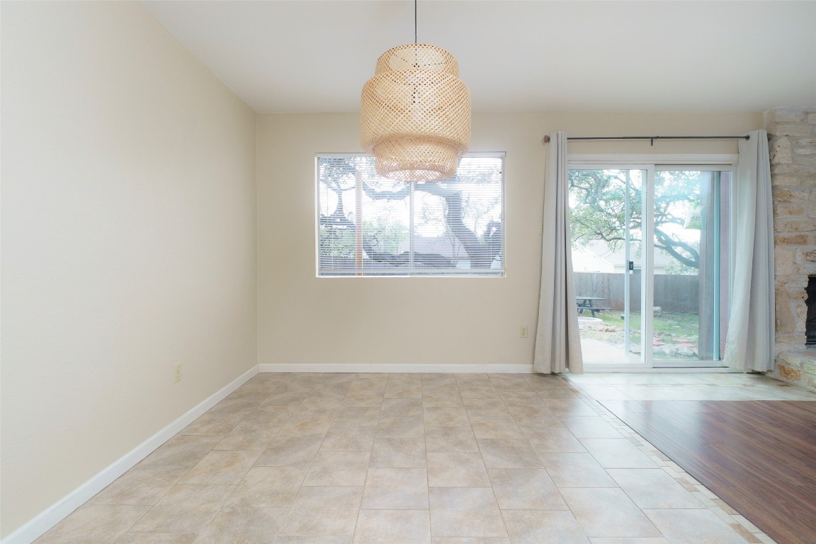 5603 Porsche Lane Austin, TX 78749 - Photo 7 of 25 an empty room with windows and outdoor view
