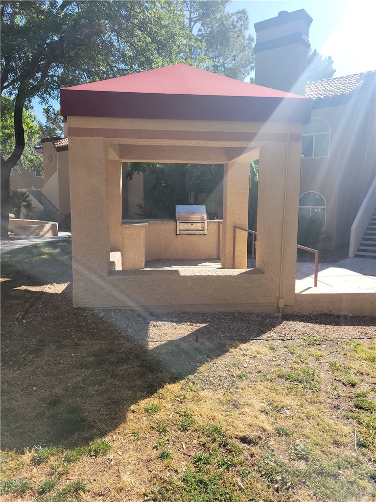 9325 West Desert Inn Road, Unit 178 Las Vegas, NV 89117 - Photo 19 of 20 An outdoor grilling station sits sheltered under a solid stucco pavilion in the common courtyard.