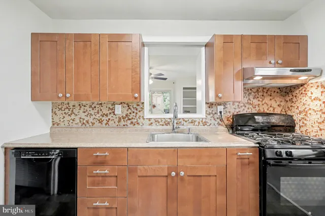 a kitchen with a stove and a refrigerator