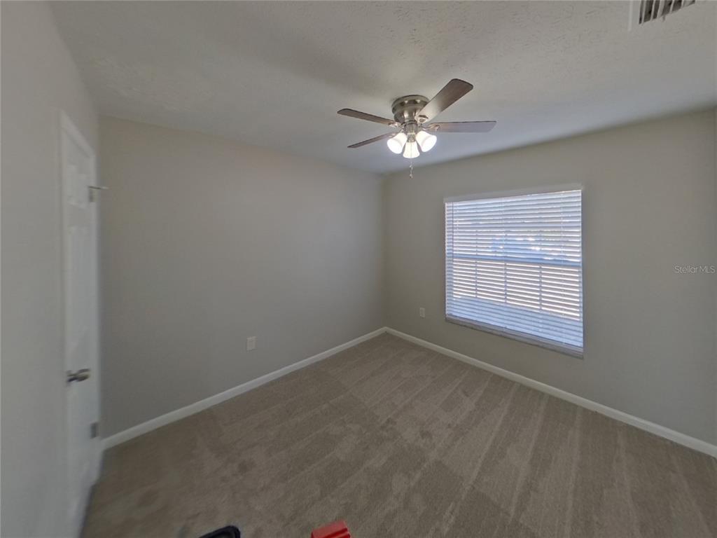 Undisclosed Address Brandon, FL 33510 - Photo 12 of 17 a view of an empty room with a window