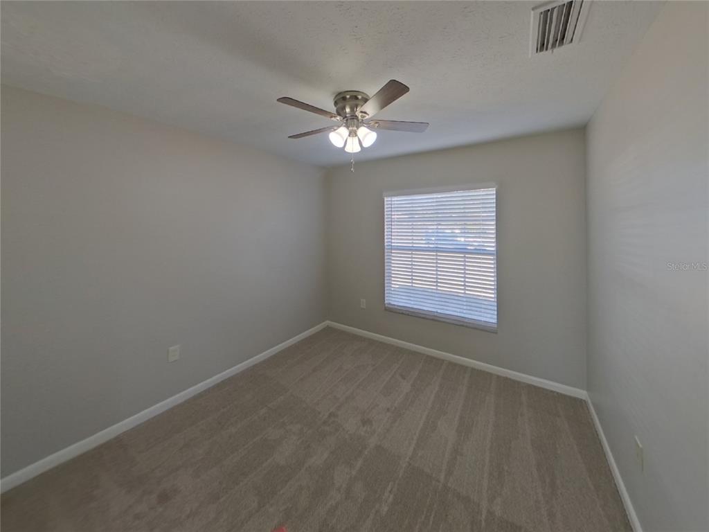Undisclosed Address Brandon, FL 33510 - Photo 13 of 17 a view of an empty room with a window