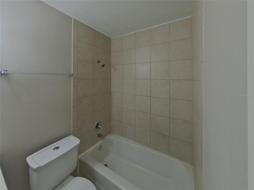 Undisclosed Address Brandon, FL 33510 - Photo 16 of 17 a bathroom with a toilet and bathtub