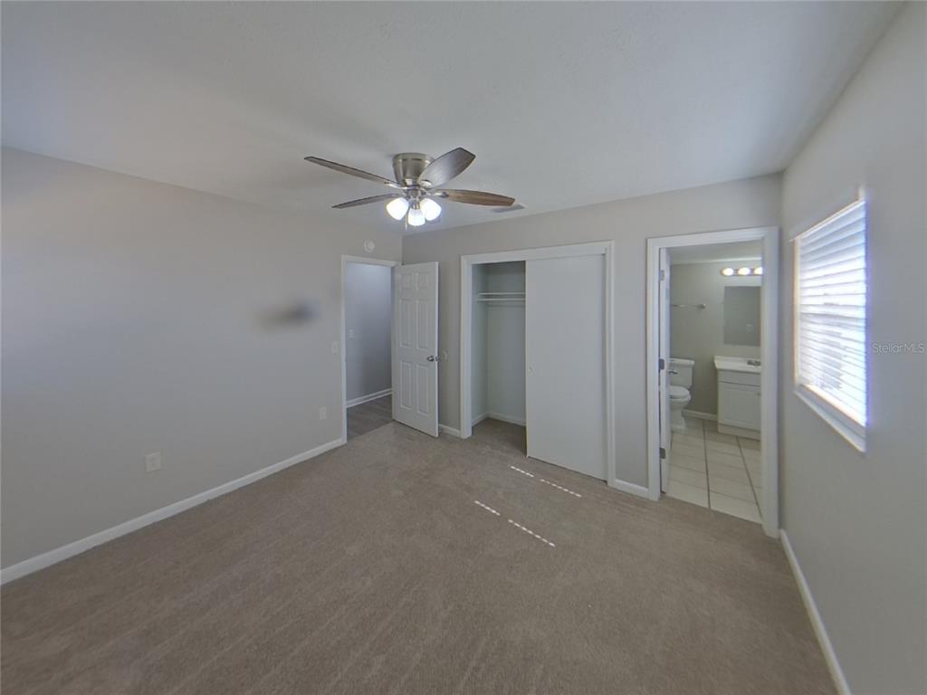 Undisclosed Address Brandon, FL 33510 - Photo 6 of 17 a view of an empty room with a chandelier fan