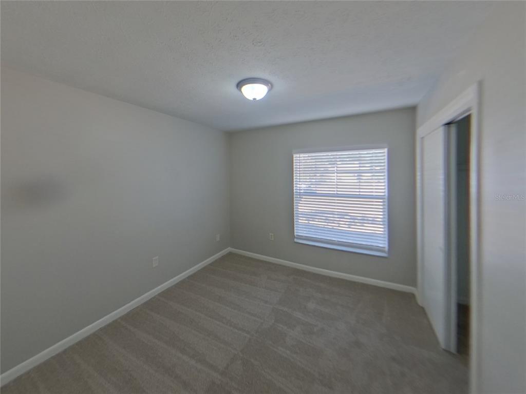 Undisclosed Address Brandon, FL 33510 - Photo 10 of 17 an empty room with a window