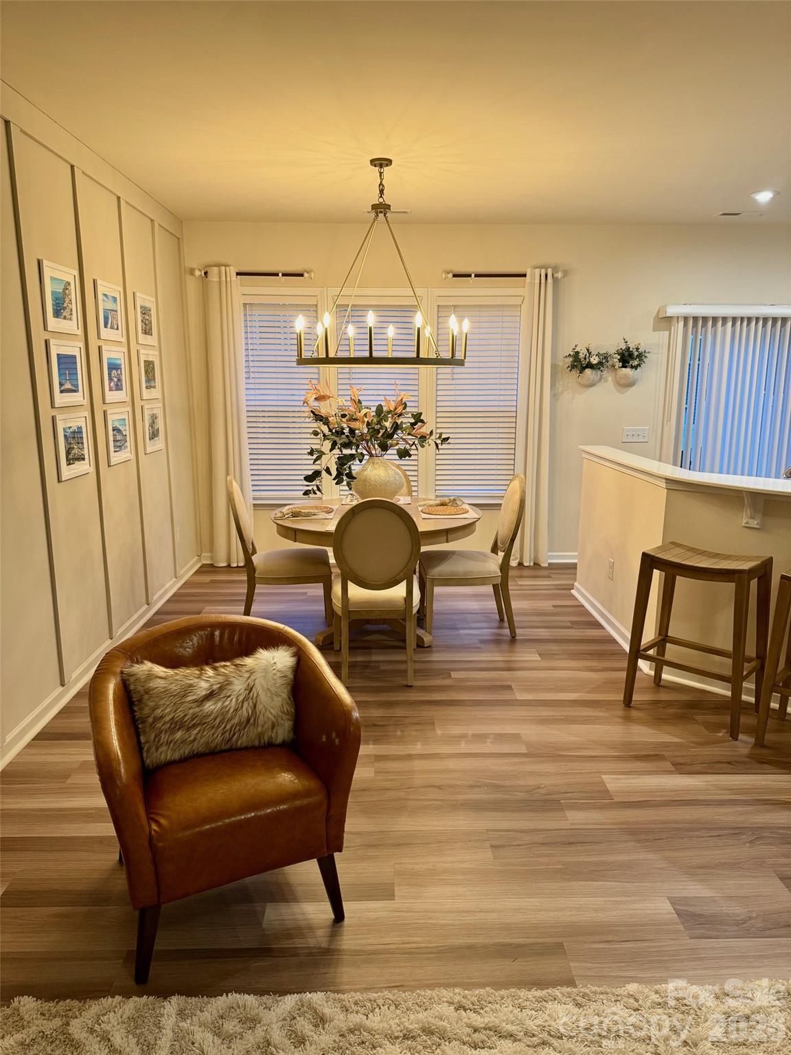 806 Canoe Song Road Fort Mill, SC 29708 - Photo 12 of 39 a living room with furniture a rug and a chandelier