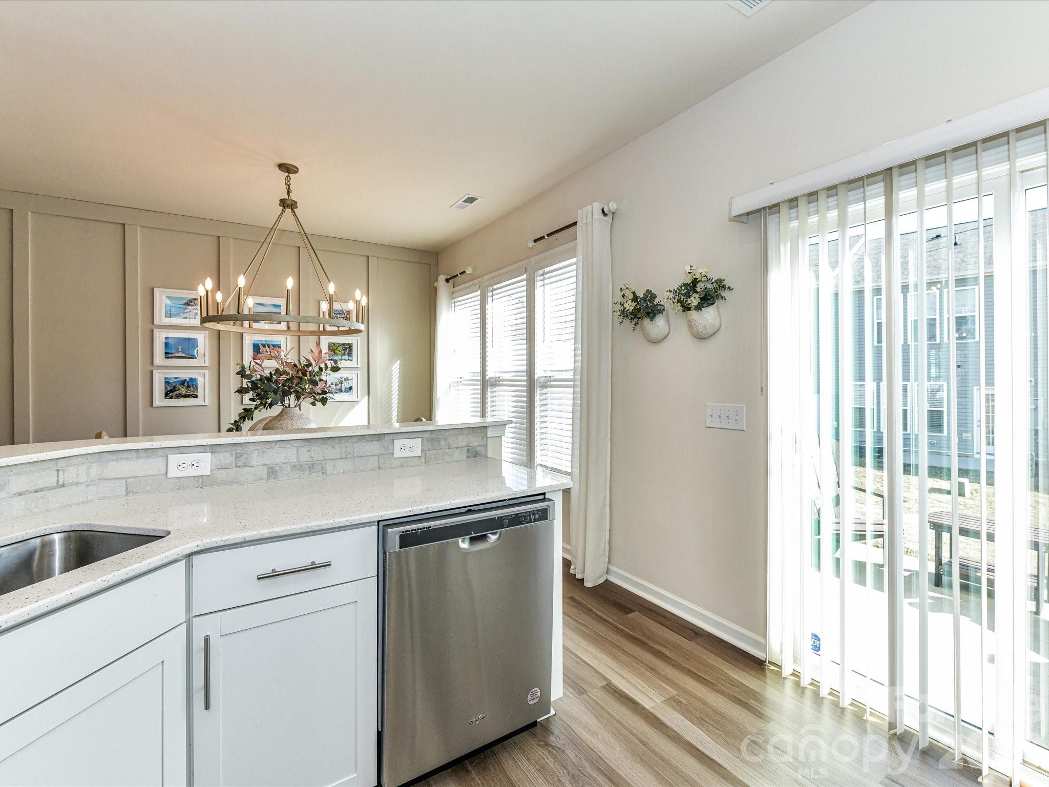 806 Canoe Song Road Fort Mill, SC 29708 - Photo 14 of 39 a kitchen with a sink and large window