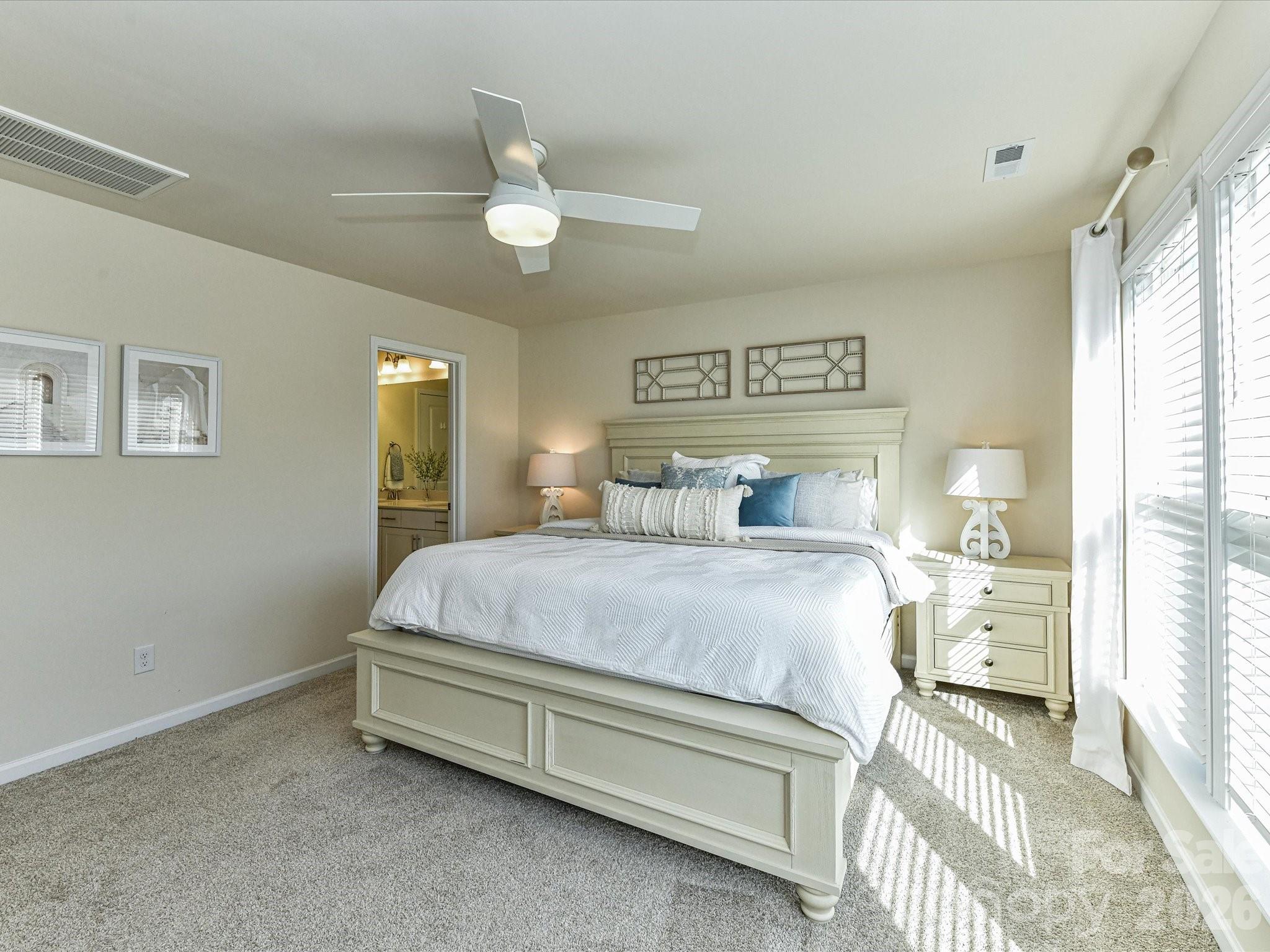 806 Canoe Song Road Fort Mill, SC 29708 - Photo 18 of 39 a bedroom with a bed and window