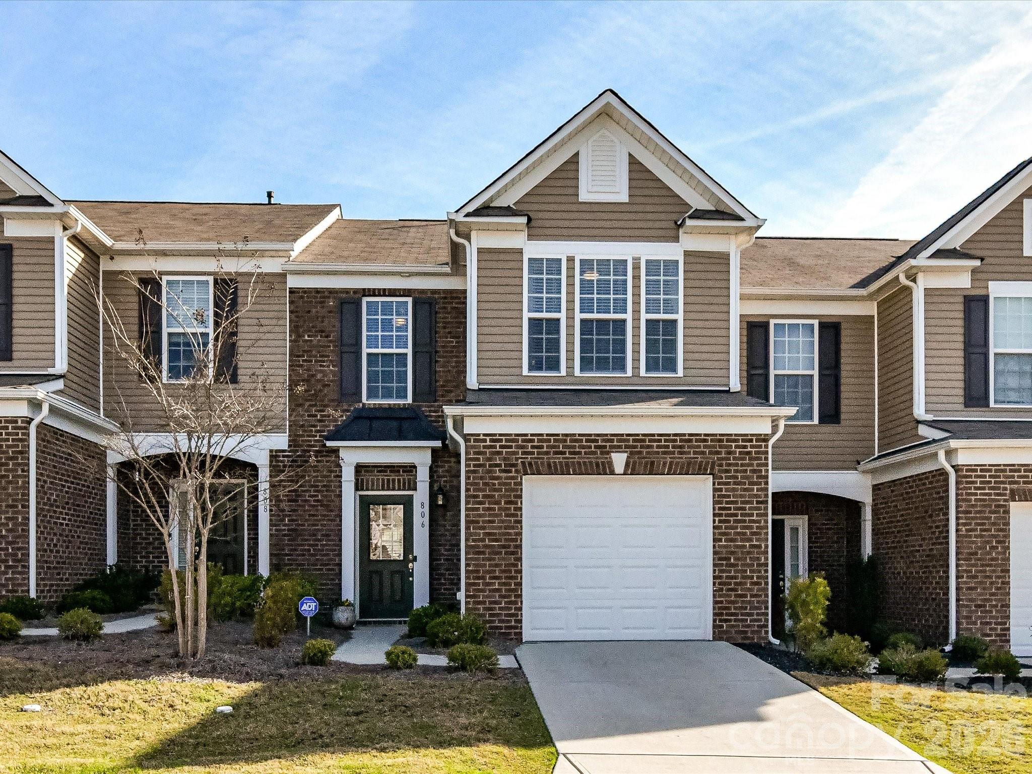 806 Canoe Song Road Fort Mill, SC 29708 - Photo 2 of 39 a front view of a house with garden