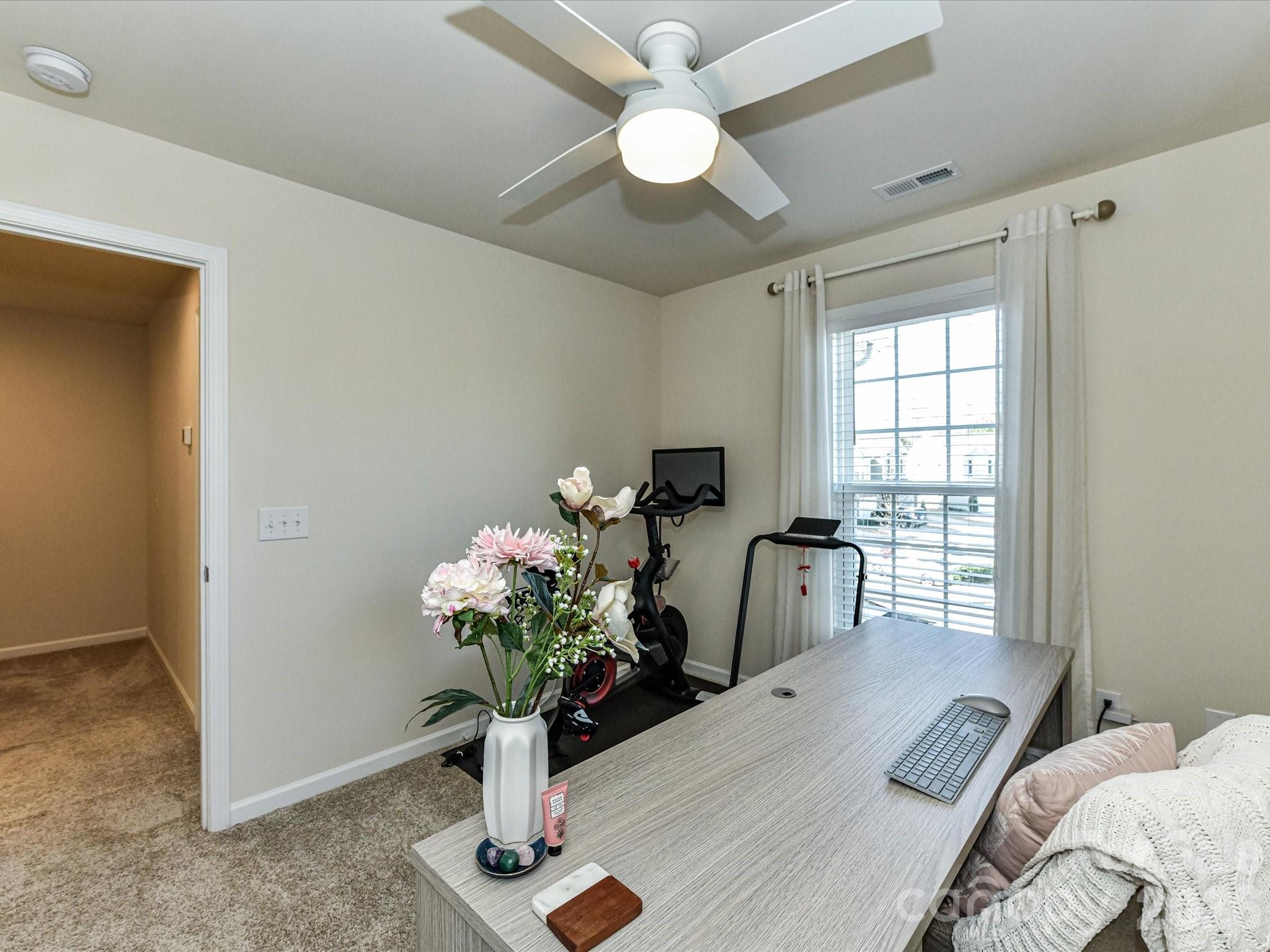 806 Canoe Song Road Fort Mill, SC 29708 - Photo 23 of 39 a bed room with a bed and a chandelier