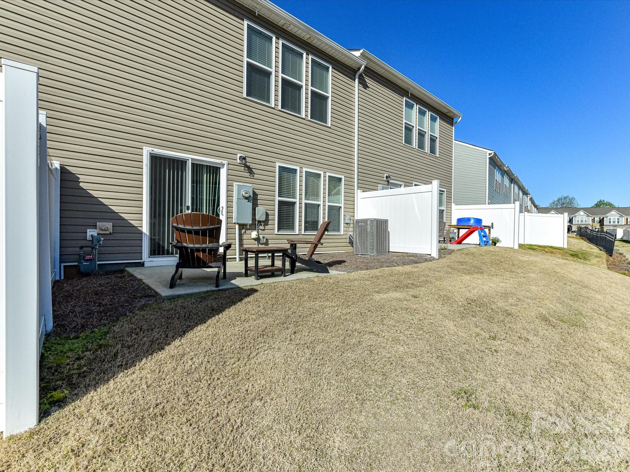 806 Canoe Song Road Fort Mill, SC 29708 - Photo 30 of 39 a view of a house with backyard and sitting area