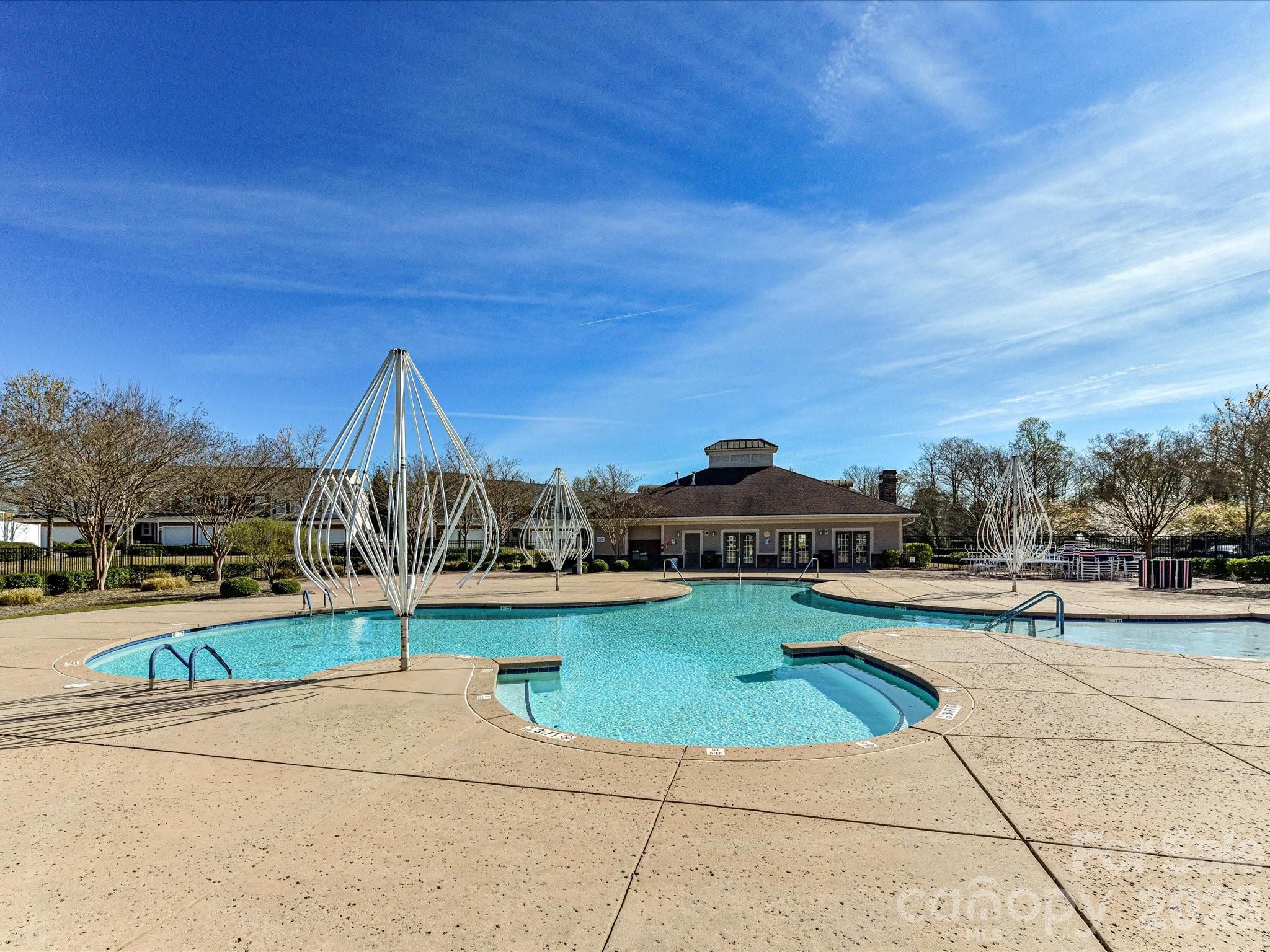 806 Canoe Song Road Fort Mill, SC 29708 - Photo 38 of 39 a view of a swimming pool with a yard and plants