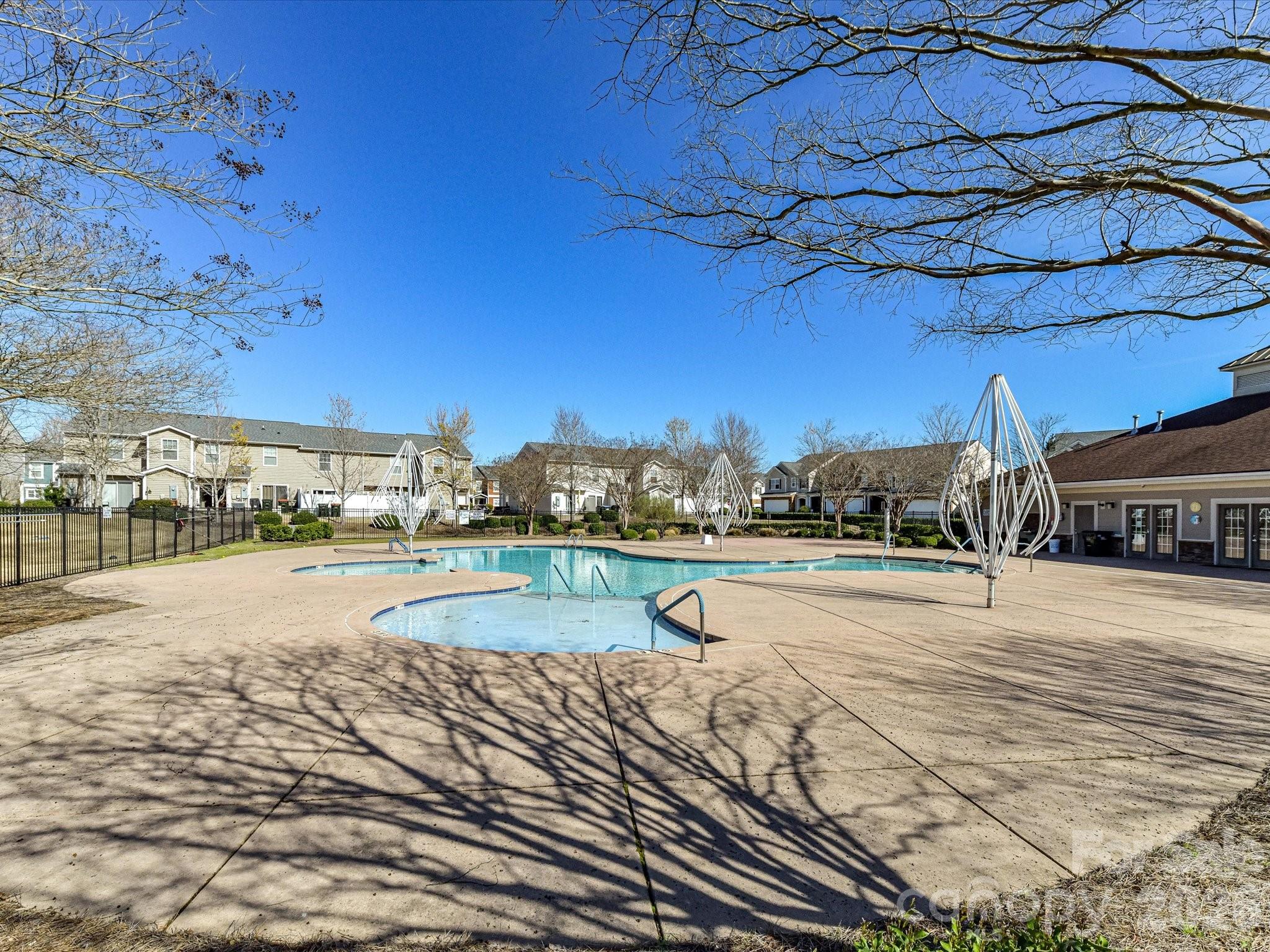 806 Canoe Song Road Fort Mill, SC 29708 - Photo 39 of 39 a view of a swimming pool with an outdoor space and seating area