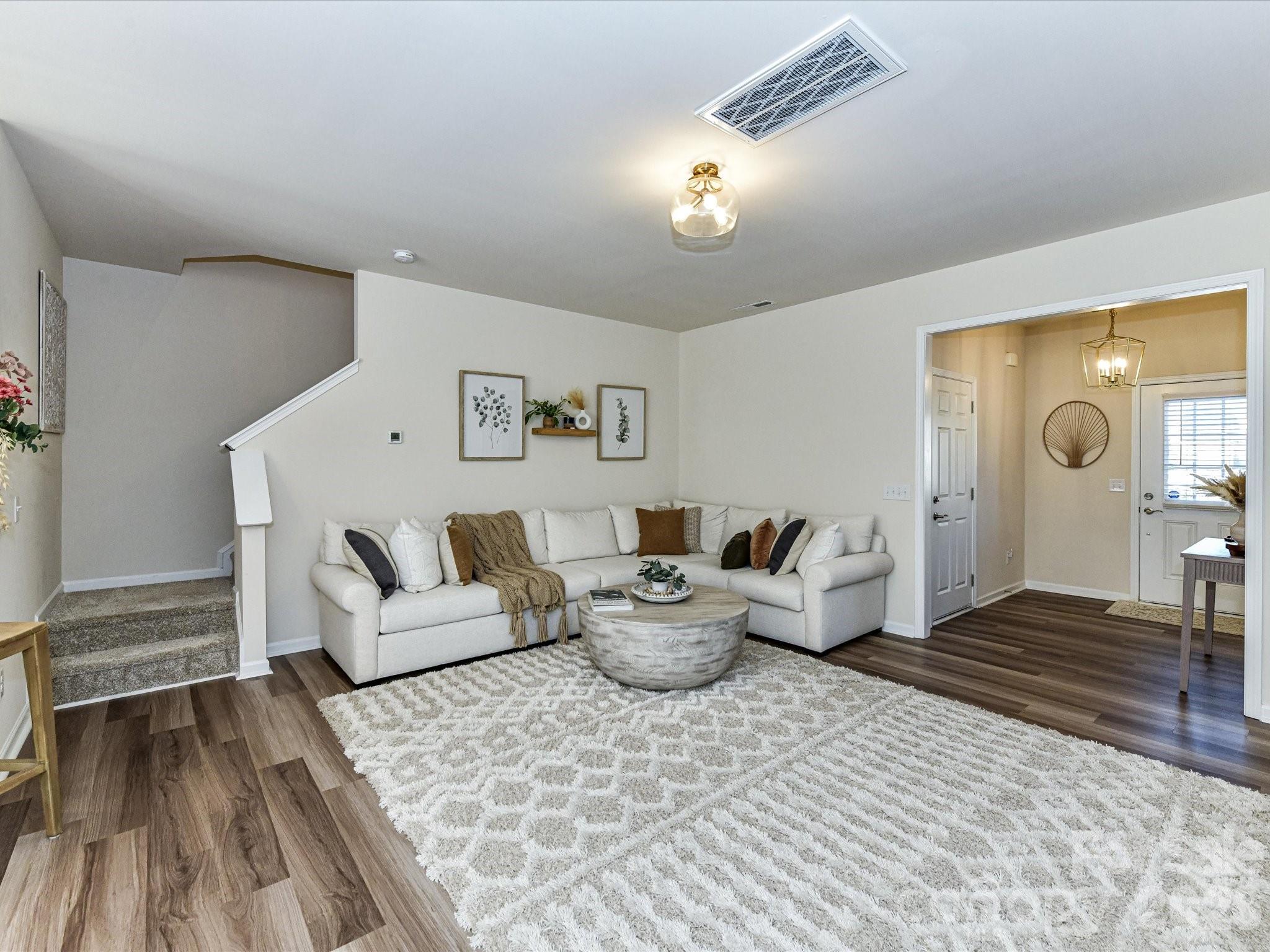 806 Canoe Song Road Fort Mill, SC 29708 - Photo 7 of 39 a living room with furniture and wooden floor