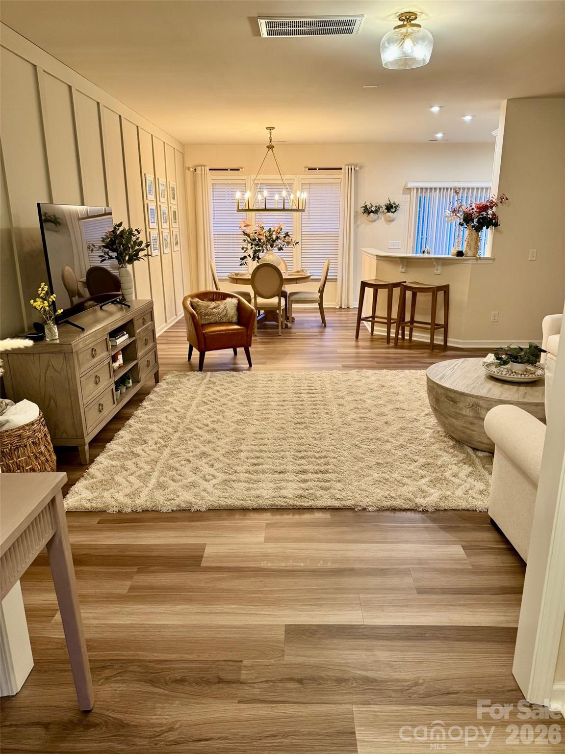 806 Canoe Song Road Fort Mill, SC 29708 - Photo 8 of 39 a living room with furniture and a flat screen tv