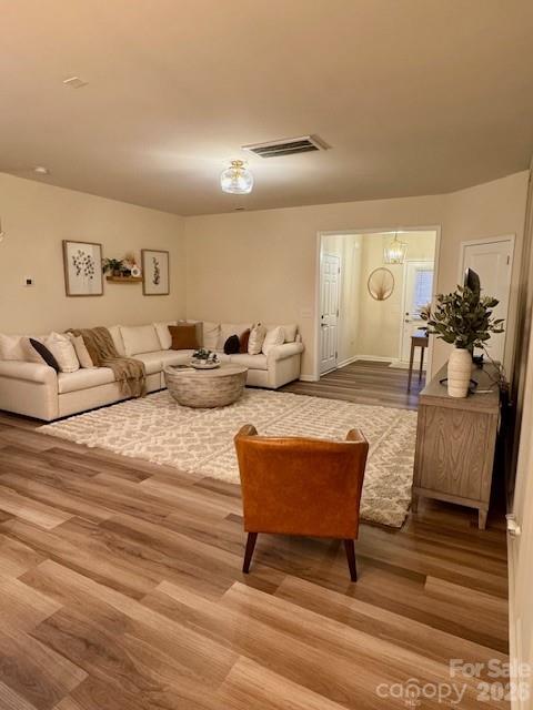 806 Canoe Song Road Fort Mill, SC 29708 - Photo 9 of 39 a living room with furniture and a chandelier