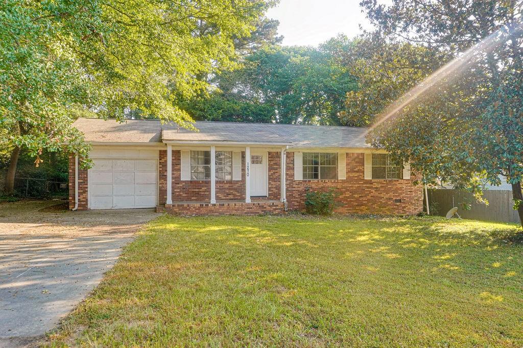 1270 Morrow Road Morrow, GA 30260 - Photo 1 of 1 a view of a house with a yard