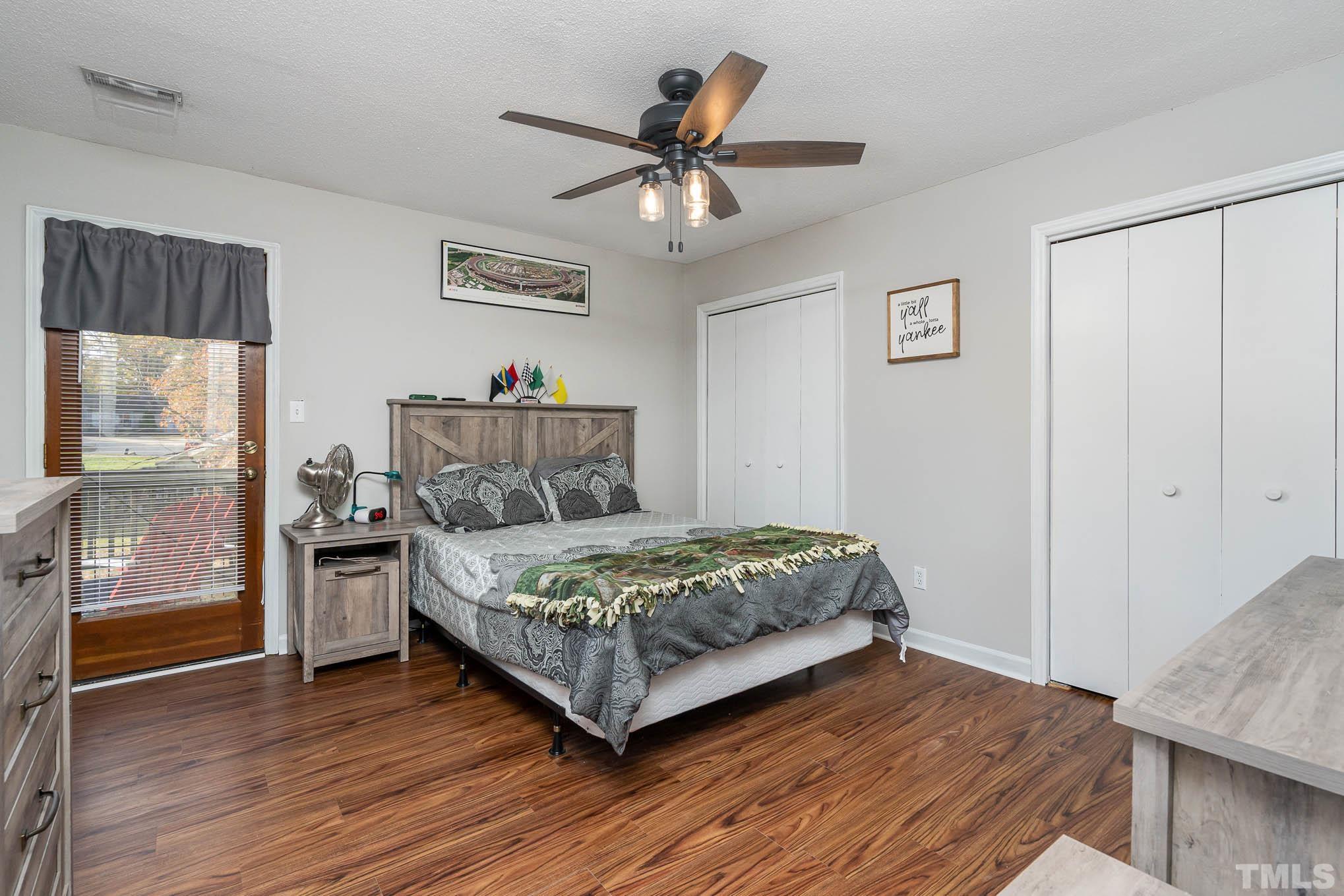4701 Courtside Place Raleigh, NC 27604 - Photo 12 of 30 a bedroom with a bed and window