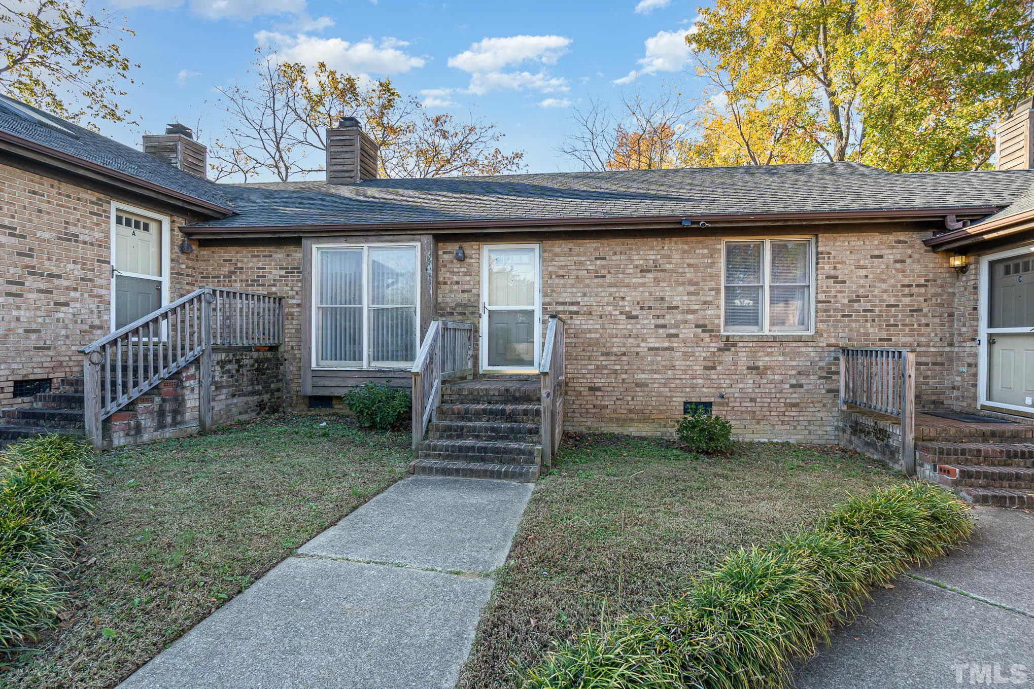 4701 Courtside Place Raleigh, NC 27604 - Photo 17 of 30 a front view of a house with garden