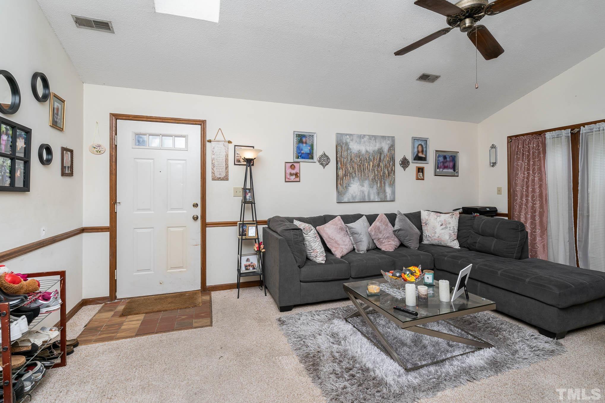 4701 Courtside Place Raleigh, NC 27604 - Photo 20 of 30 a living room with furniture and a rug