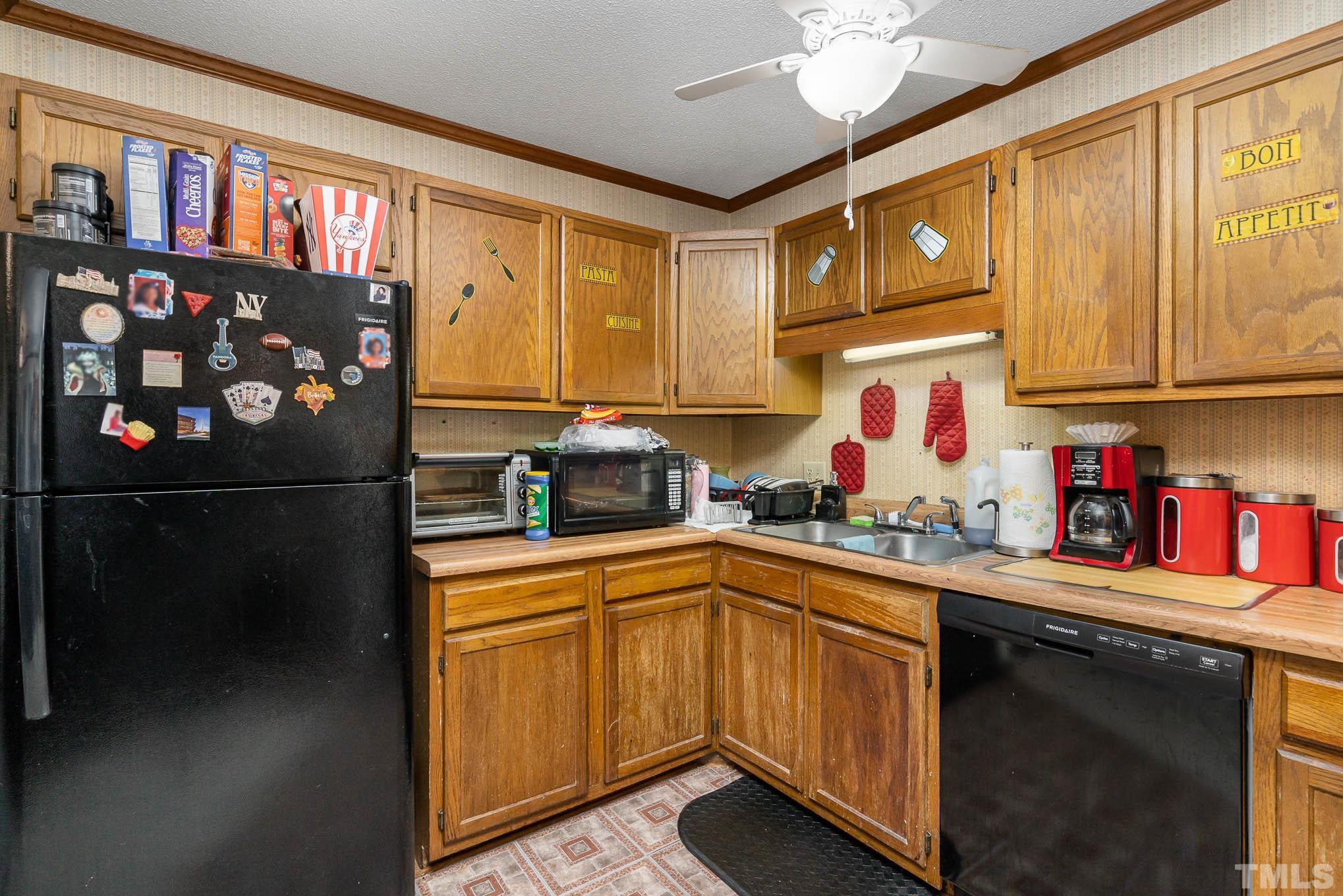 4701 Courtside Place Raleigh, NC 27604 - Photo 24 of 30 a kitchen with stainless steel appliances granite countertop a sink stove and refrigerator