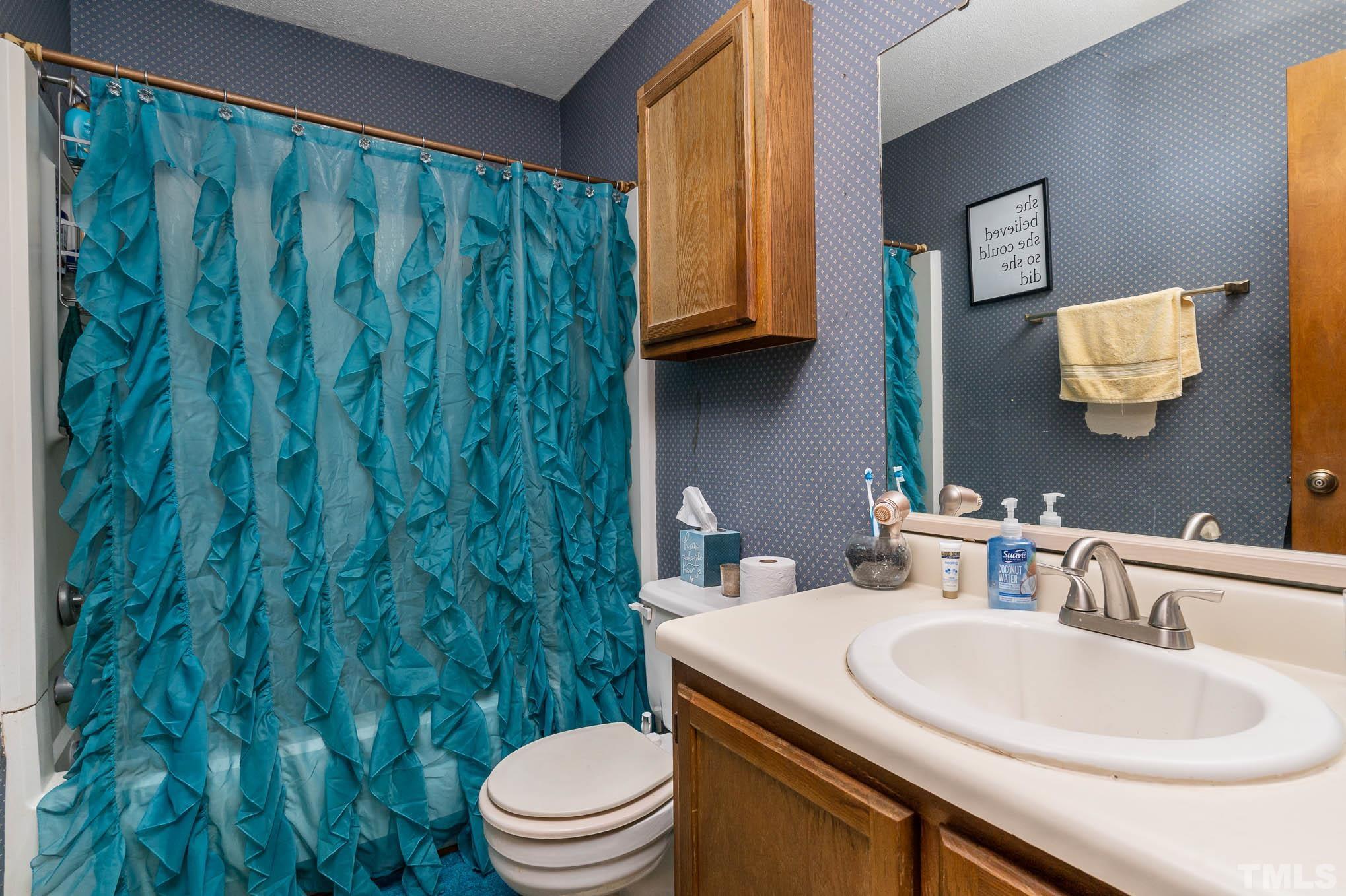 4701 Courtside Place Raleigh, NC 27604 - Photo 29 of 30 a bathroom with a toilet a sink and garden view
