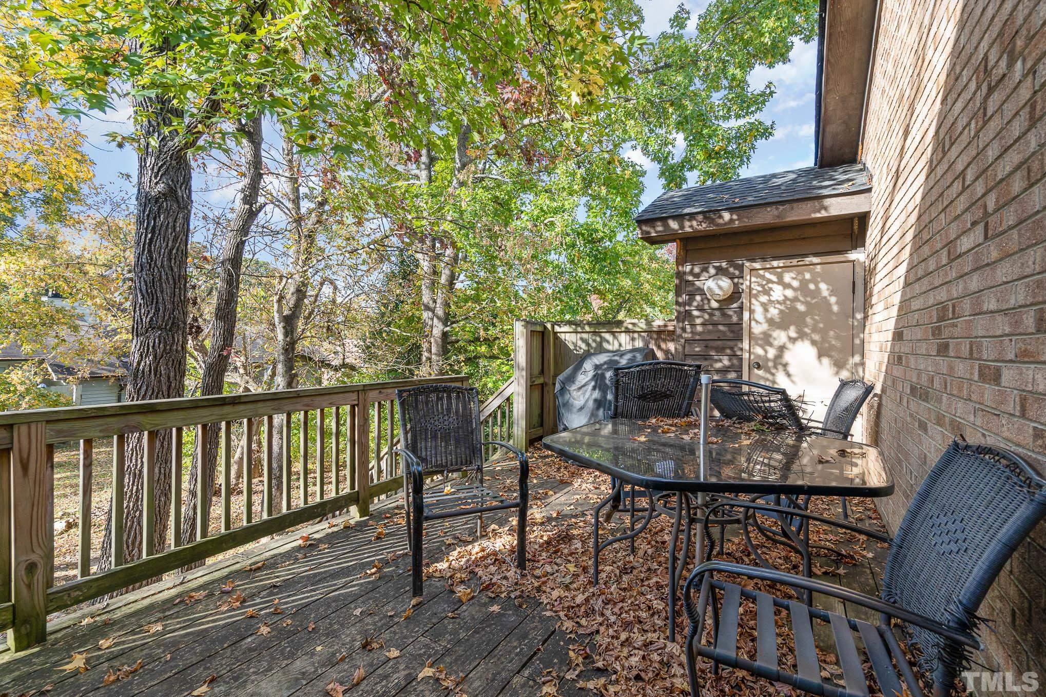 4701 Courtside Place Raleigh, NC 27604 - Photo 30 of 30 a view of balcony with wooden floor and outdoor seating