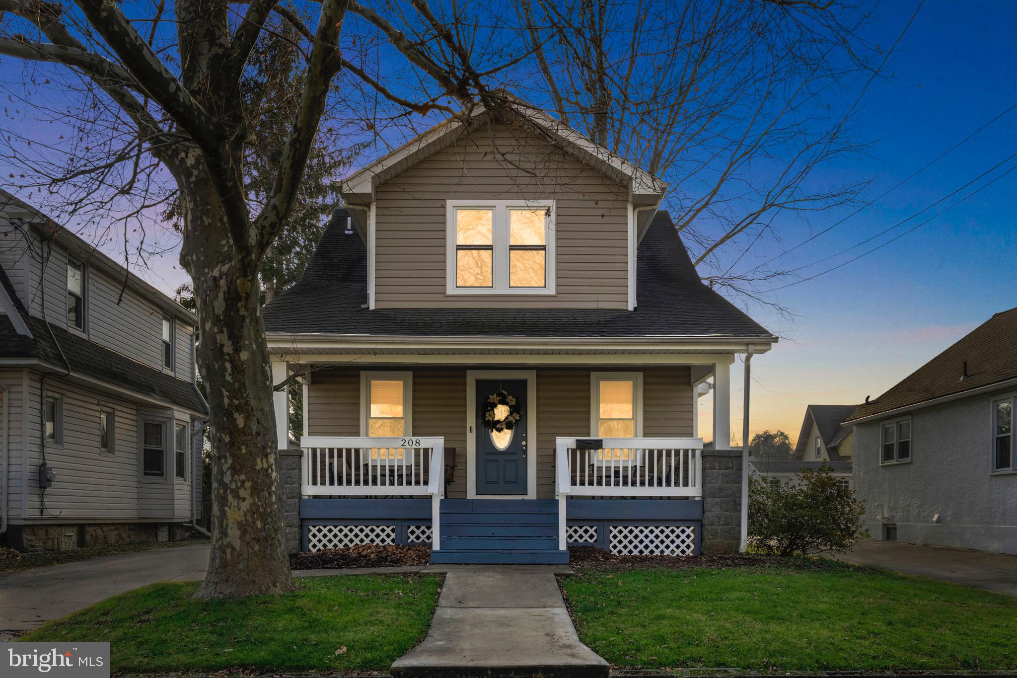 208 Willow Road Wallingford, PA 19086 - Photo 1 of 39 a front view of a house with garden