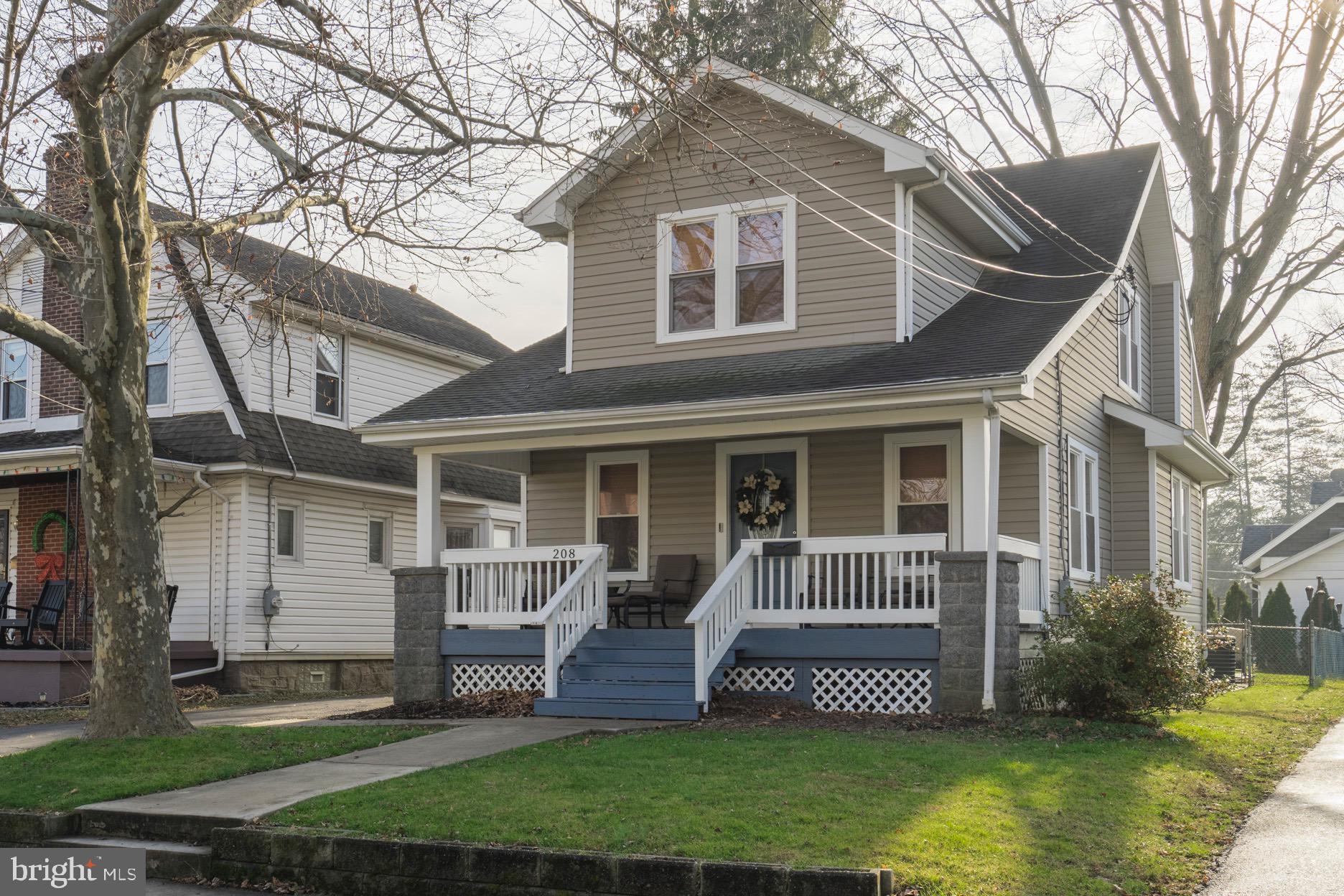 208 Willow Road Wallingford, PA 19086 - Photo 2 of 39 a front view of a house with a garden