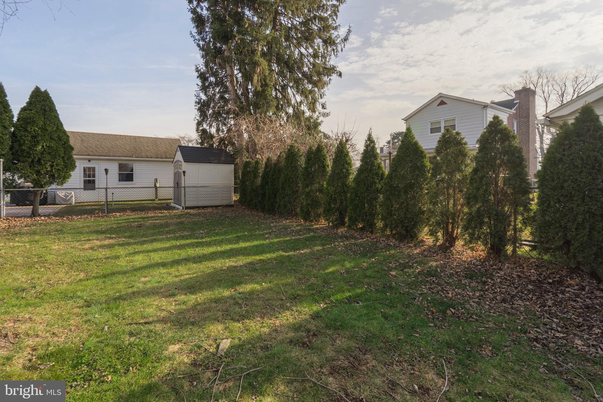 208 Willow Road Wallingford, PA 19086 - Photo 34 of 39 a backyard of a house with lots of green space