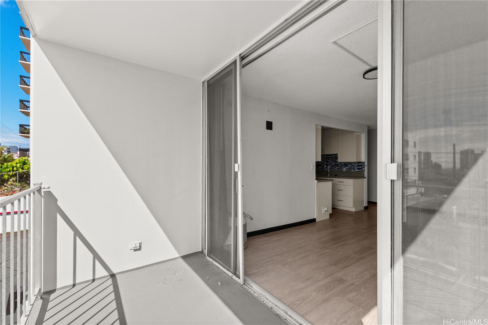 1069 Spencer Street, Unit 101 Honolulu, HI 96822 - Photo 5 of 19 a view of a hallway with a kitchen space