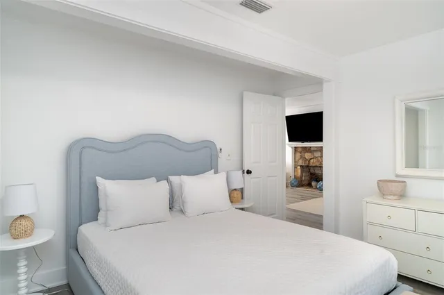 a bathroom with a toilet a sink and a window