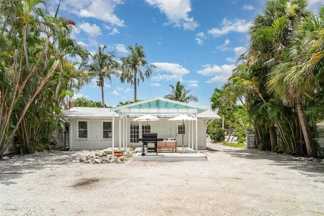 a view of a patio with couches under an umbrella